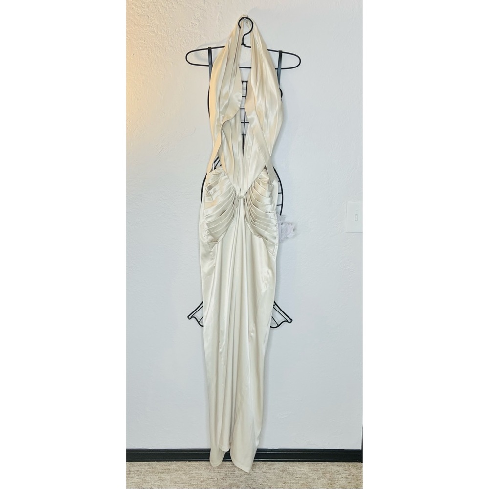 Cream satin backless gown.